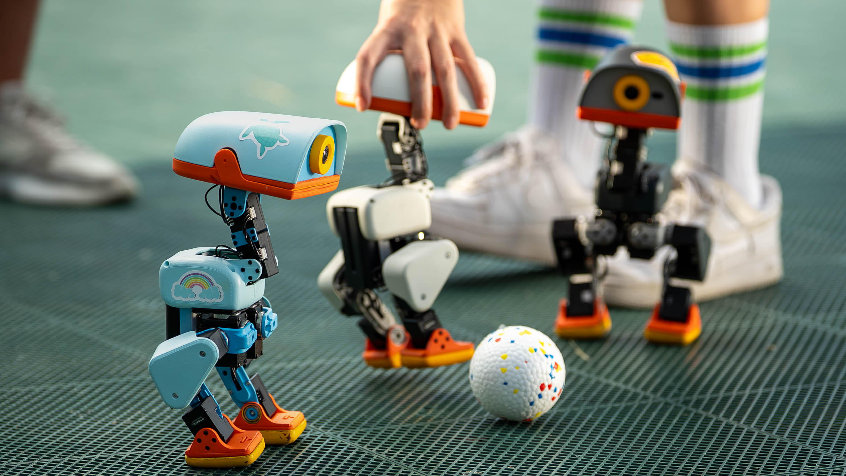 MicroDuck robots in an official Pollen Robotics photograph.